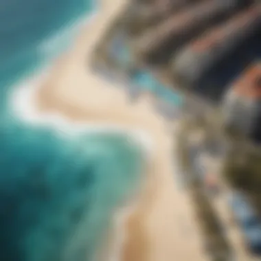 Aerial Perspective of La Mer Beach Aerial view of La Mer Beach showcasing the azure waters and vibrant beachside promenade.