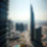 Aerial view of the Edge Building highlighting its unique architecture against the Dubai skyline